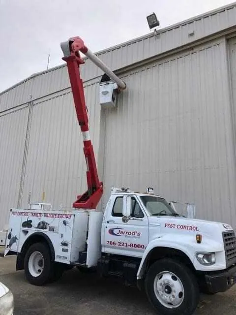Bird Control in Columbus, GA: Jarrod's bucket truck for high roofline work